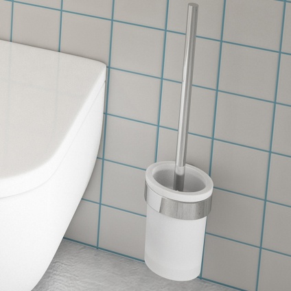 close up lifestyle image of origins living pirenei chrome toilet brush set on white tiled wall